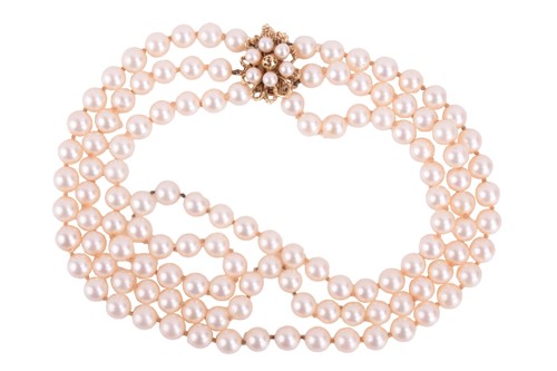Lot 65 - A three-row cultured pearl necklace with...