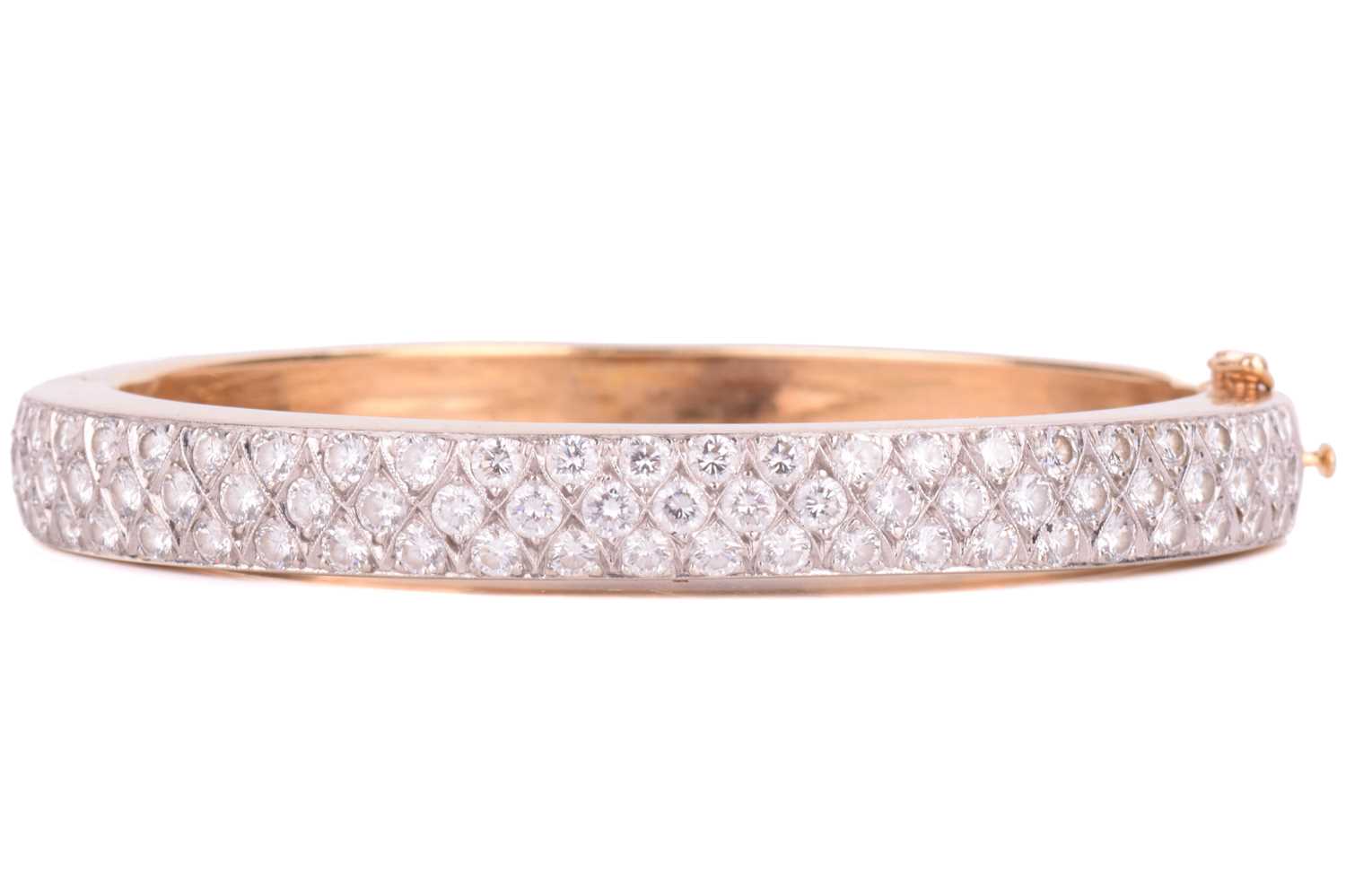 Lot 45 - A diamond-set hinged bracelet, consisting of...
