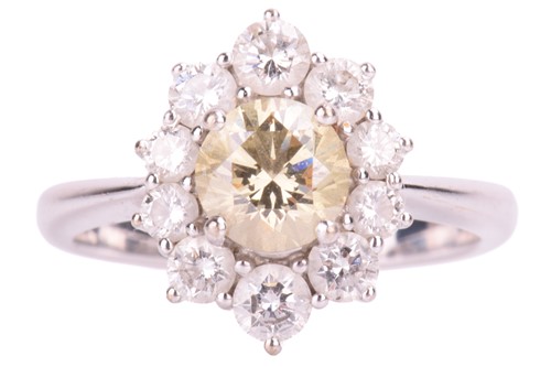 Lot 110 - A diamond cluster ring, set to the centre with...