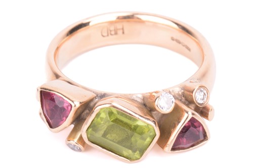 Lot 32 - A peridot, tourmaline and diamond dress ring...