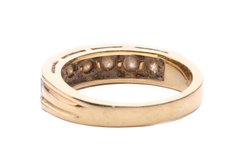 Lot 64 - A seven-stone half-hoop diamond ring, channel...