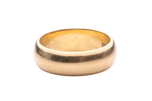 Lot 11 - A wedding ring in 18ct gold, the D-section...