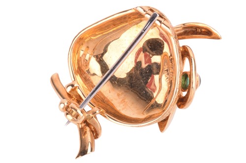 Lot 239 - Cartier - an emerald-set brooch in the form of...