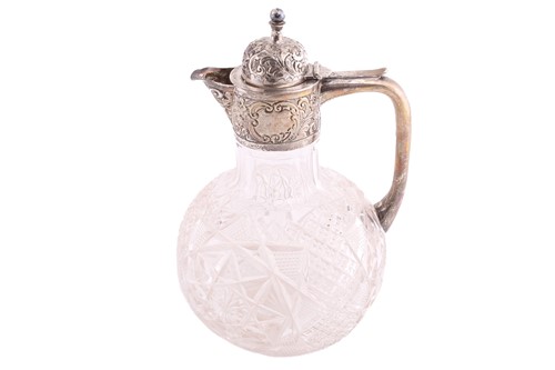 Lot 396 - A Victorian silver mounted claret jug, the...