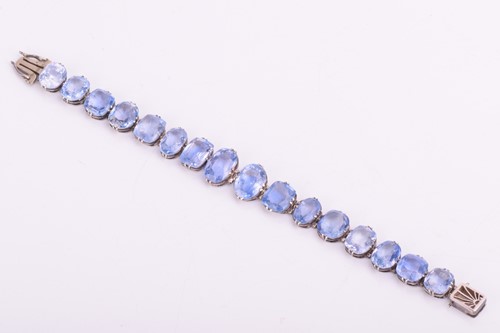 Lot 98 - A Ceylon sapphire bracelet, set with a row of...