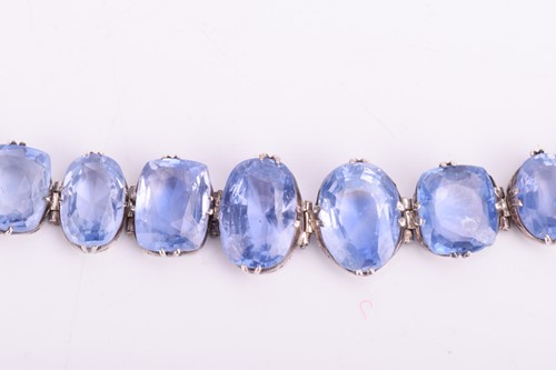 Lot 98 - A Ceylon sapphire bracelet, set with a row of...