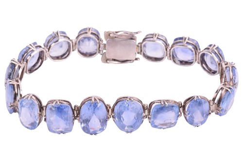 Lot 98 - A Ceylon sapphire bracelet, set with a row of...