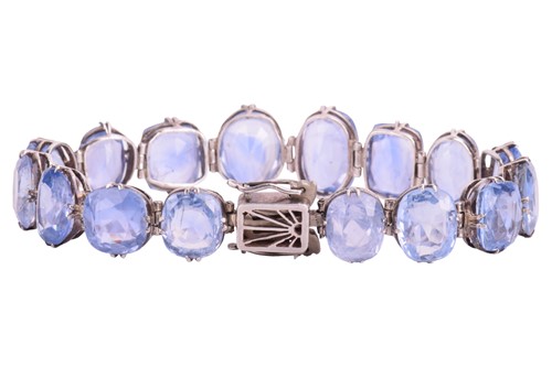 Lot 98 - A Ceylon sapphire bracelet, set with a row of...