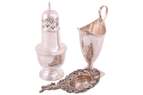 Lot 209 - A George III silver helmet cream jug with a...