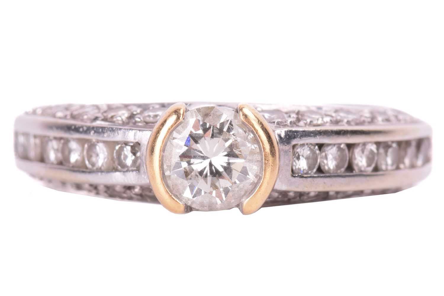 Lot 97 - A diamond solitaire ring, set with a round...