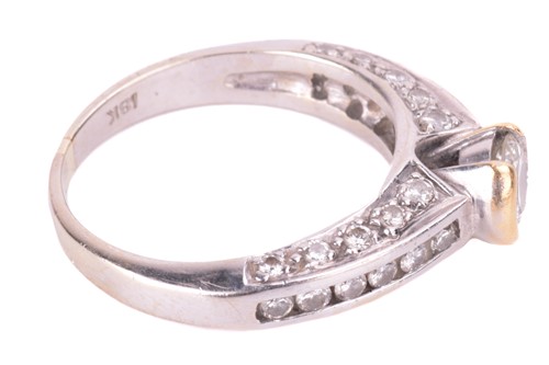 Lot 97 - A diamond solitaire ring, set with a round...
