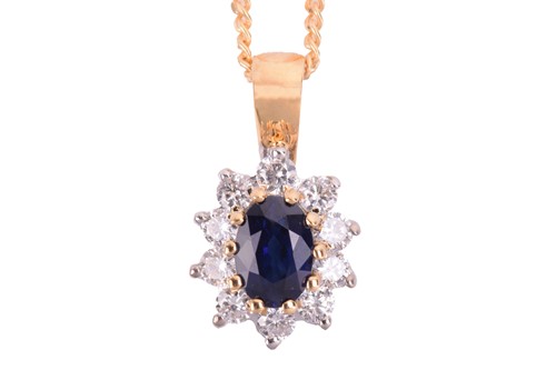 Lot 24 - A sapphire and diamond cluster pendant in 18ct...