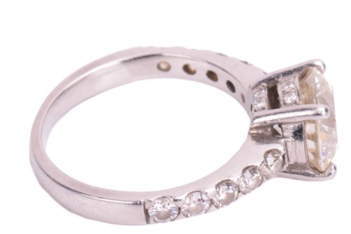 Lot 48 - A single stone diamond ring; the round...
