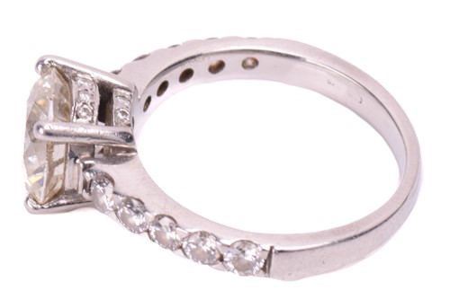 Lot 48 - A single stone diamond ring; the round...