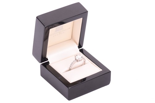 Lot 48 - A single stone diamond ring; the round...