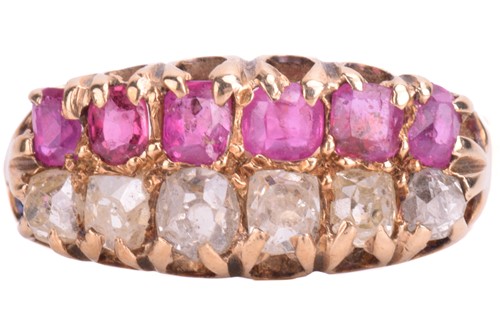 Lot 232 - A double row old-cut diamond and ruby ring....