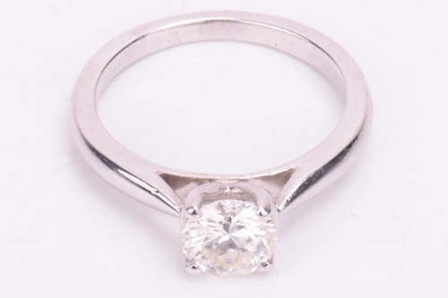 Lot 73 - A solitaire diamond ring, featuring a central...