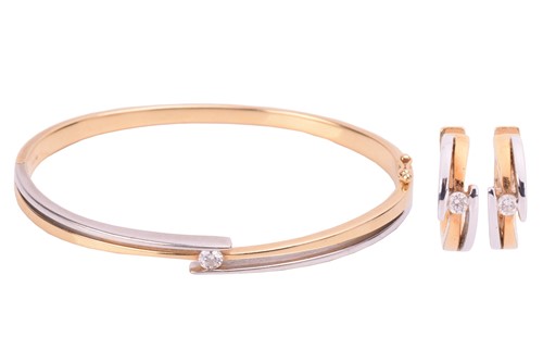 Lot 11 - A diamond bangle and earring suite; the bangle...
