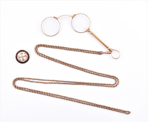 Lot 628 - A yellow metal opera length Albert chain the...