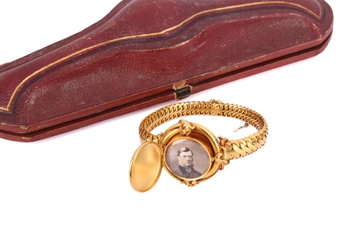 Lot 48 - A Victorian enamel and diamond locket bracelet,...