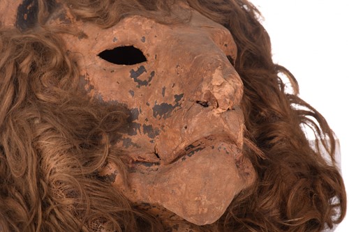 Lot 330 - An original papier mache lion mask, used as a...