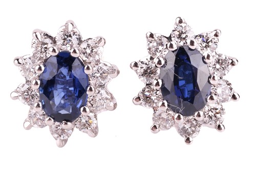 Lot 44 - A pair of sapphire and diamond cluster stud...