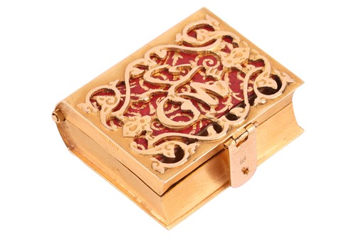 Lot 104 - A miniature Qur'an holder pendant, of book...