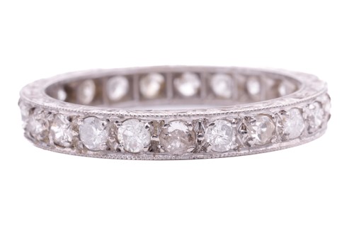 Lot 58 - A diamond eternity ring, grain set with twenty-...