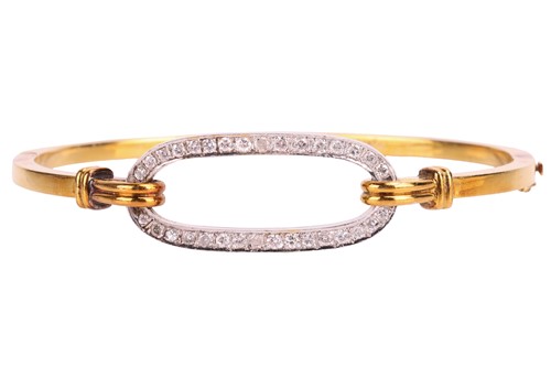 Lot 116 - A diamond set bi-colour hinged bangle, the...