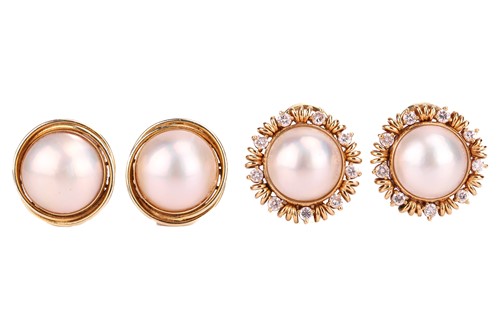 Lot 110 - A pair of cultured pearl ear clips, bezel set...