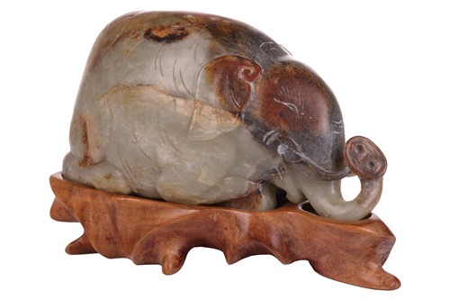 Lot 108 - A large Chinese green, grey and russet Jade...