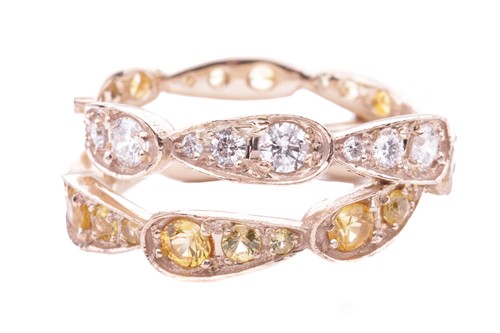 Lot 91 - A diamond and citrine set double band dress...