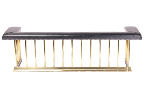 Lot 180 - A brass Club Fender, with black leather...