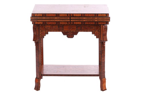 Lot 204 - A Damascus inlaid fold-over gaming table with...