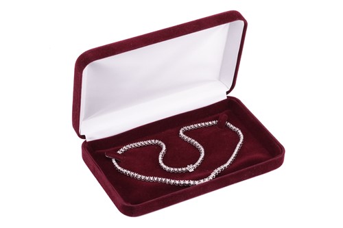 Lot 94 - A diamond line necklace set with a single row...