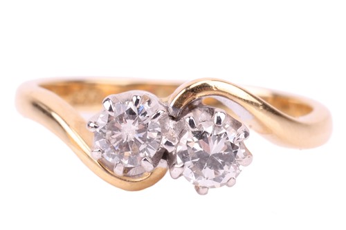 Lot 14 - A diamond-set toi et moi ring, each round...