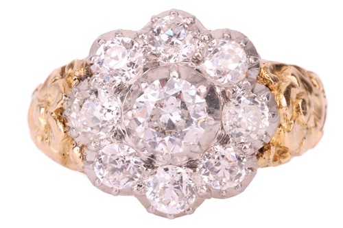 Lot 149 - A diamond cluster ring featuring an array of...