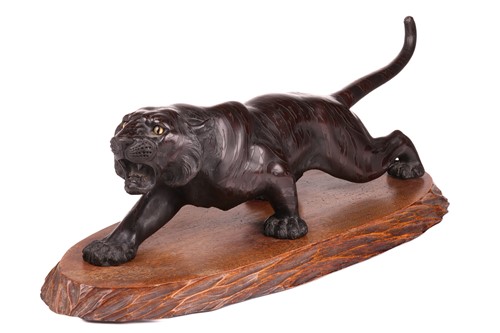 Lot 3 - A Japanese bronze okimono of a stalking tiger,...