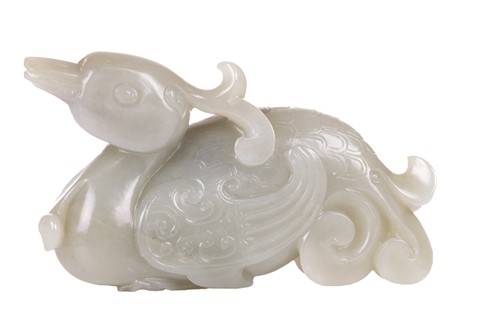 Lot 40 - A Chinese grey green carved Jade figure of a...