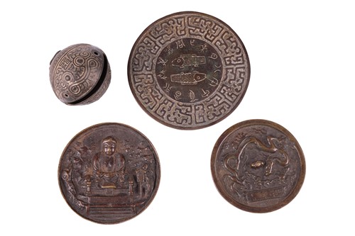 Lot 11 - A Chinese patinated bronze circular mirror,...