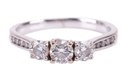 Lot 30 - A diamond three-stone ring. Set with round...