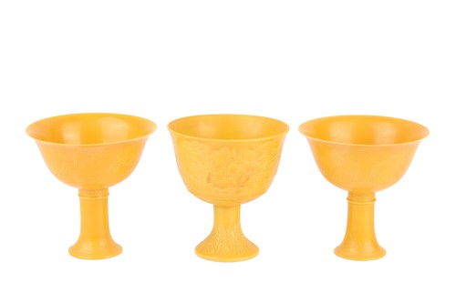Lot 65 - A pair of Chinese yellow ground porcelain stem...
