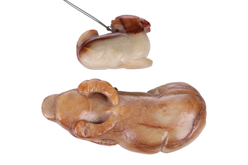 Lot 7 - A Chinese carved jade figure of a recumbent...