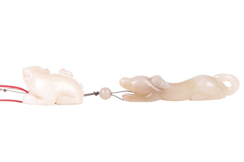 Lot 9 - A Chinese carved mutton fat jade figure of a...
