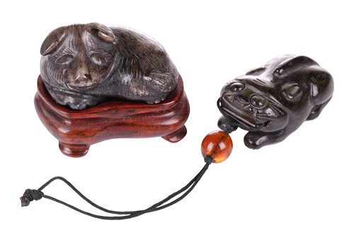 Lot 28 - A Chinese dark green jade toggle in the form...