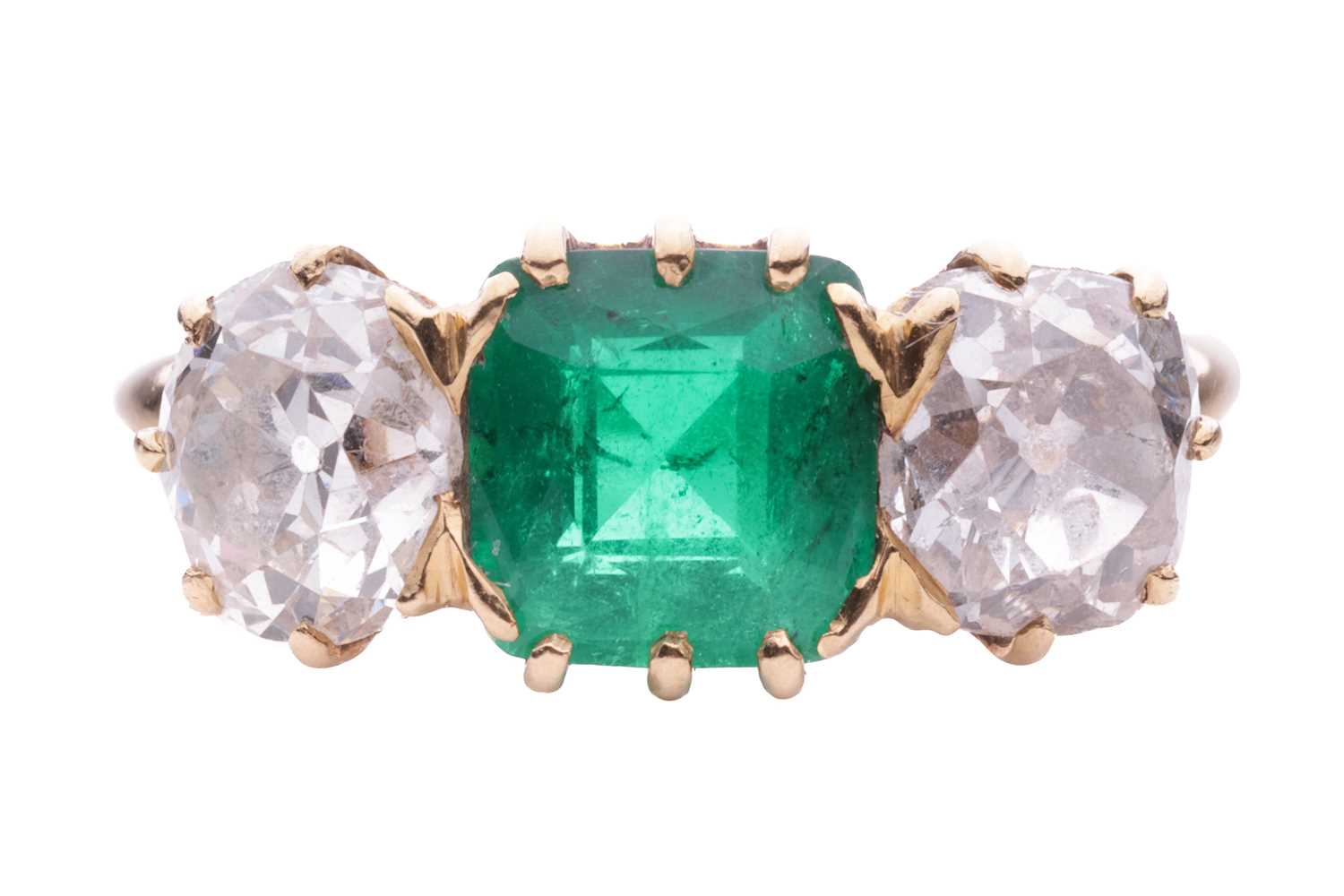 Lot 152 - An emerald and diamond three stone ring, the...