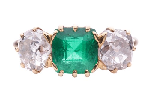 Lot 152 - An emerald and diamond three stone ring, the...
