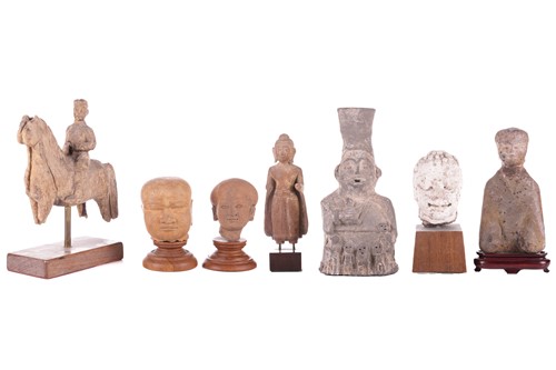 Lot 13 - An Oriental carved sandstone head of a...