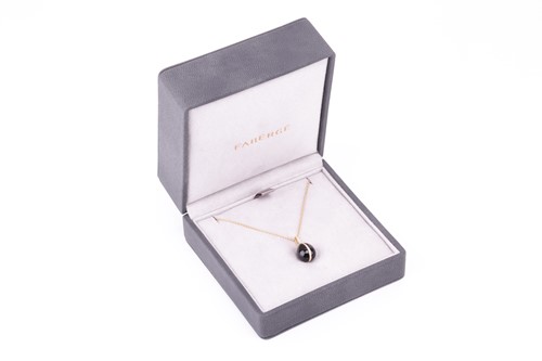 Lot 97 - A Fabergé Whitby jet egg pendant, the cabochon...