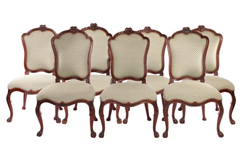 Lot 127 - A set of seven George II style walnut cartouch...